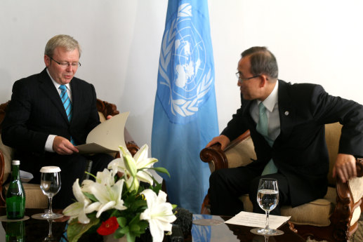 Then-prime minister Kevin Rudd hands over the signed Kyoto agreement to the then-United Nations secretary-general as part of the 2007 UN Climate Change Conference in Bali.