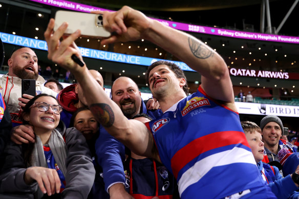 Tom Liberatore celebrates with fans.