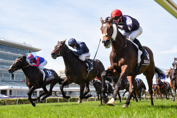 Jye McNeil races to victory on Twilight Payment in the Melbourne Cup. 
