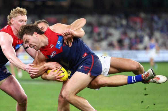 Future teammates? Demon Jack Viney is  tackled by Roo Will Phillips.