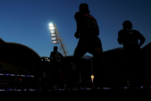 The Storm run out onto AAMI Park.