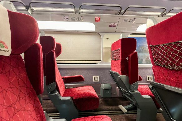 The well-padded, red-upholstered seats recline marginally.