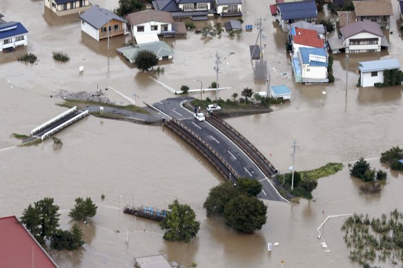 A road in Nagano, central Japan, submerged after the Chikuma River overflowed due to Typhoon Hagibis. 