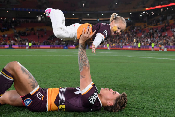 Reece Walsh celebrates his preliminary final win with his daughter
