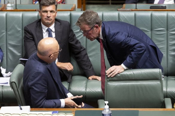 Dan Tehan speaks to Peter Dutton in parliament yesterday.