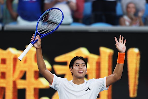 Learner Tien of the United States acknowledges the crowd following victory over Daniil Medvedev.