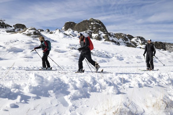 Tracey Devon, Adam Schulz and Phil Hayes from Jindabyne skiing after recent snowfall in the Snowy Mountains on Thursday.
