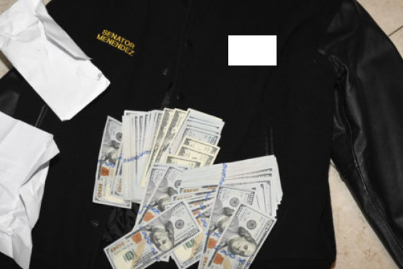 A jacket bearing Menendez’s name, along with cash from envelops found inside the jacket.