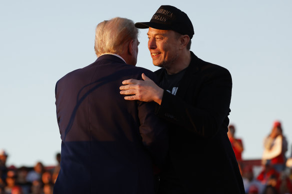 Elon Musk embraces Donald Trump during a campaign rally in October.