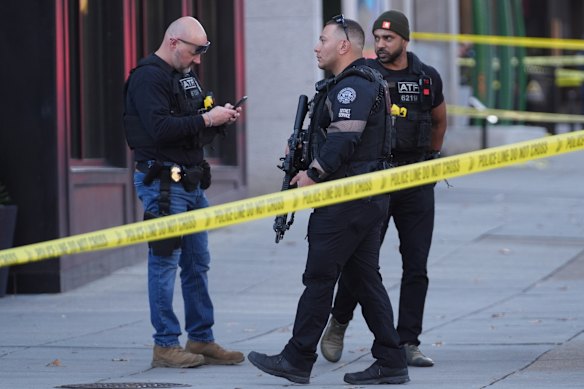 Law enforcement officers in Washington after two National Guard soldiers were shot near the White House.