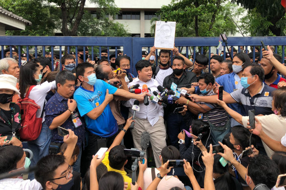 Protest leader Parit “Penguin” Chiwarak outside the criminal court in Bangkok after his release on bail on August 15.