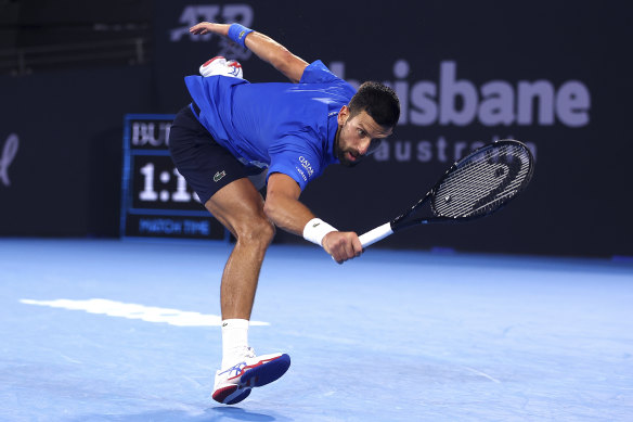 Novak Djokovic plays a shot in his match against Reilly Opelka.