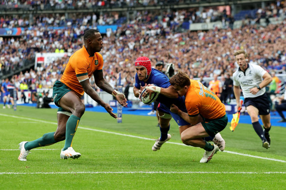 Gabin Villiere dives over in the corner in front of a packed Stade de France.