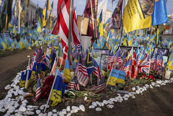 American and Ukrainian flags placed in honour of fallen servicemen in a memorial in central square in Kyiv, Ukraine, last November. 