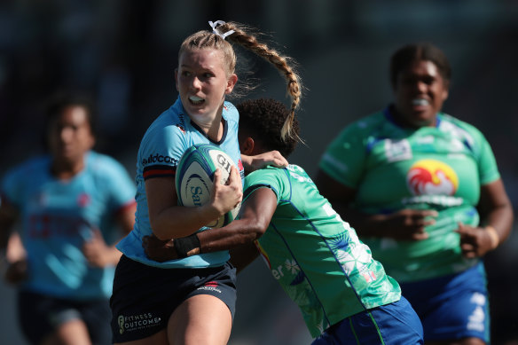 Jade Sheridan on the attack for the Waratahs against the Fijian Drua.