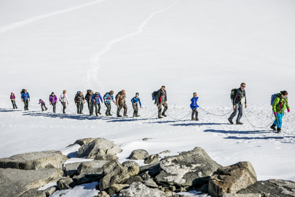 Aiming for the summit and roped in for the glacier-crossing.