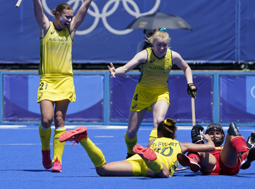 Australia midfield Renee Taylor (21) and midfield Amy Rose Lawton (4) celebrate after Grace Stewart (30) scored on Spain during their match.