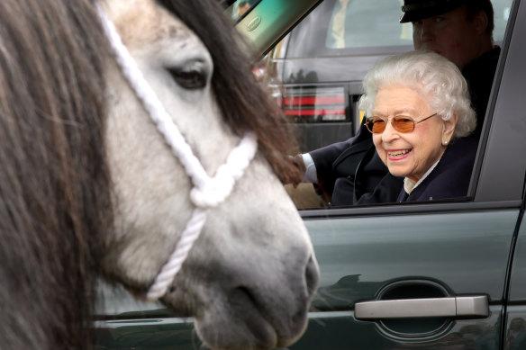 Queen Elizabeth II watches the horses from her Range Rover at The Royal Windsor Horse Show at Home Park in Windsor, England.