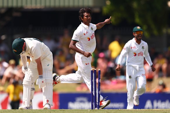 Travis Head cuts a forlorn figure after being bowled by Hasan Mahmud on day three of the Test in Darwin.