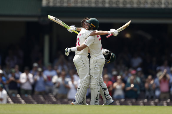 Marnus Labuschagne celebrates with Tim Paine after reaching his double century at the SCG. 