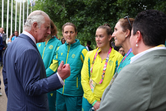 Prince Charles meets with athletes and members of the Australia team as he visits the athletes’ village.