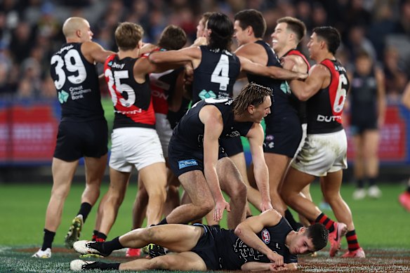 Not happy: The Blues remonstrate after Adam Cerra was crunched by Sam Durham.