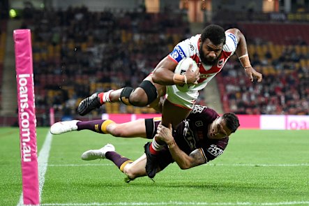 Dragons winger Mikaele Ravalawa crashes over for one of his two tries against the Broncos.