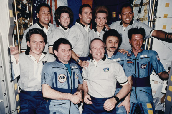 US and Russian crews including Mike Foale, front right, beside cosmonaut Alexander Lazutkin, and Russian commander Vasily Tsibliyev, front second from left.