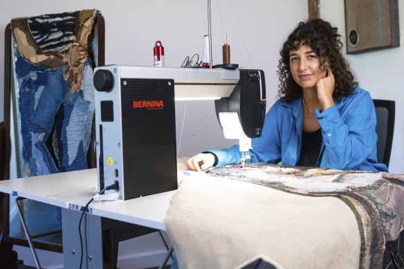 Julia Gutman inside her studio with her industrial sewing machine.