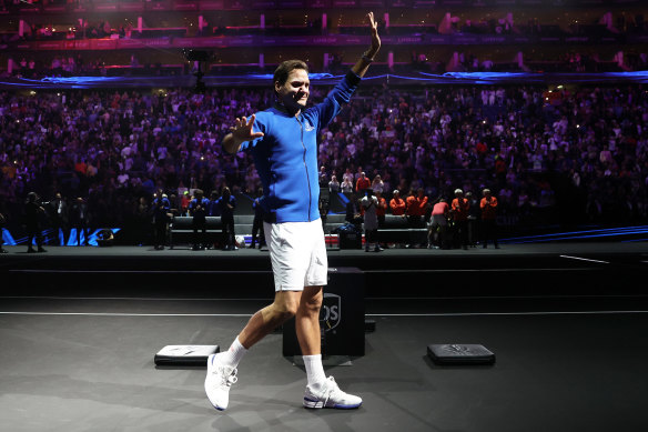 Roger Federer acknowledges the crowd after his final tennis match.