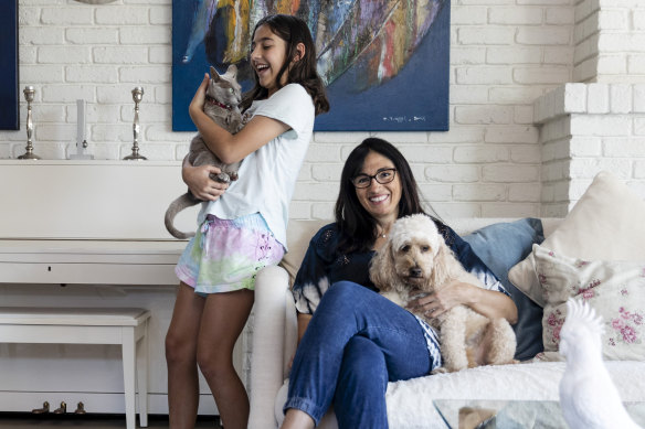 Christina Caddy-Gold with her daughter Avalon and two of their pets, Atlantis the cat and Cappuccino the dog.