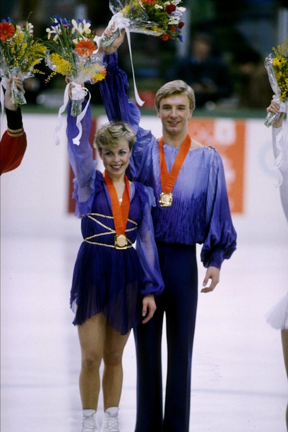 Jayne Torvill and Christopher Dean celebrate their gold medals in 1984.