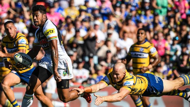 What crisis? Waqa Blake breaks free en route to the try line for the Panthers.