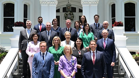 Queensland Premier Steven Miles (left front) is seen with his new ministers outside Government House in Brisbane.