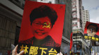 Protesters with placards denouncing Hong Kong’s Chief Executive Carrie Lam in June 2019.