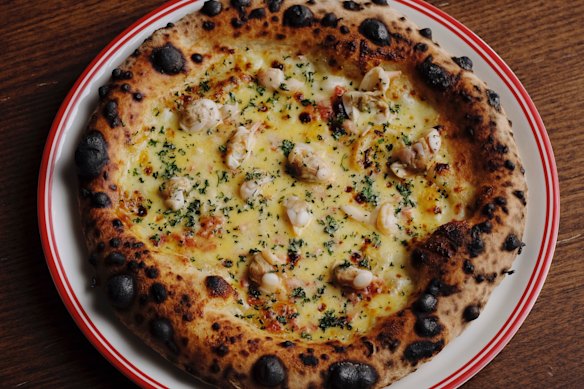 Fans flock to Capitano for charry pizza (pictured) and rectangular grandma-style pies.