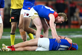 Concerned teammate Clayton Oliver checks on Melbourne’s Angus Brayshaw after he was knocked out after clashing with Collingwood’s Brayden Maynard during the 2023 finals series.