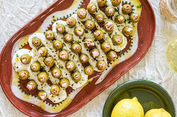 A cool schmear of dirty martini dip topped with mortadella-stuffed olives. Trust us, you need this.