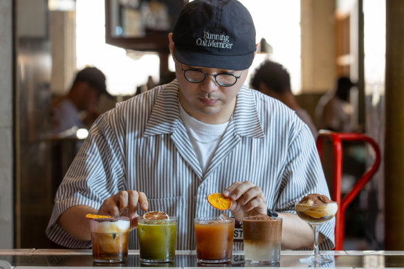 St Ali’s head barista Alex Wang with four of the cafe’s new drinks.