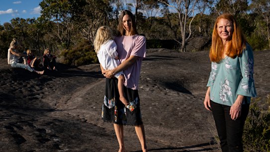 Local residents Nicole Romain (right) and Thea Harris (left) are opposed to plans by the Metro Aboriginal Land Council to build hundreds of homes in bushland at Belrose. 