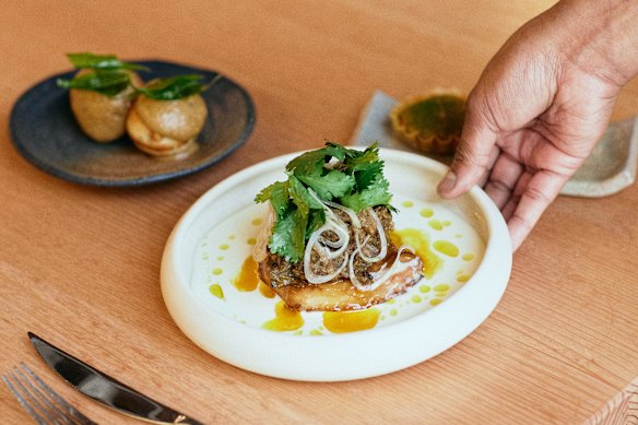 Kosha Mangsho (slow-roasted lamb neck, swede and yoghurt dressing), plus paniyaram (fermented rice doughnuts) with onion chutney  at the Saadi pop-up at Sunda.