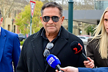 Nicky Winmar, centre, who was found guilty of assault, is pictured here with his lawyer Dermot Dann, left.