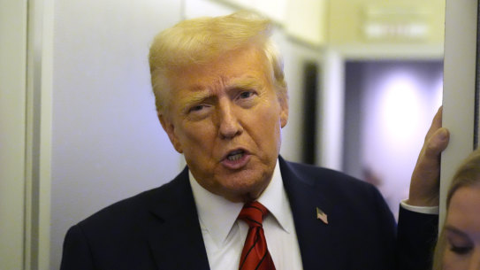 President Donald Trump, pictured here on Air Force One on Monday, has moved to ban transgender people from the US military.