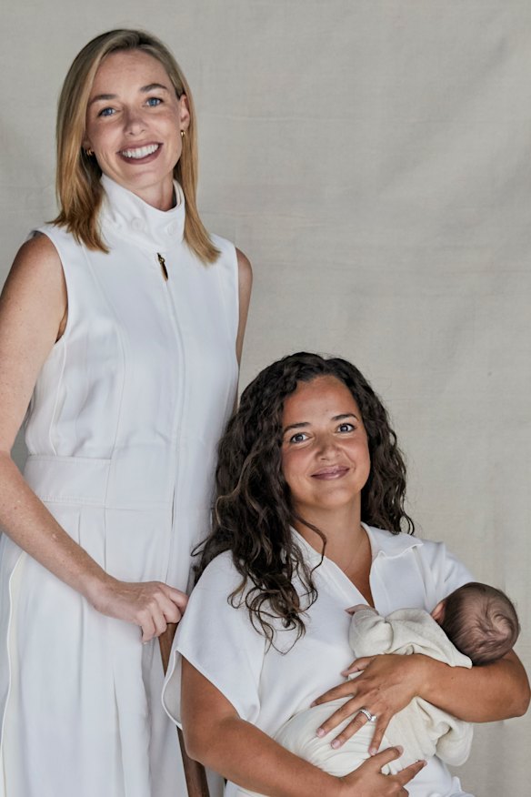 Ashleigh Raper (standing) gave birth to baby Mia for her best friend, Lucy Koops.