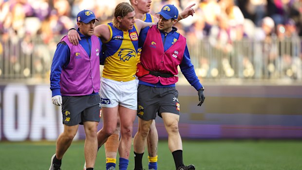 Eagle Harley Reid being helped off the field on Saturday. 