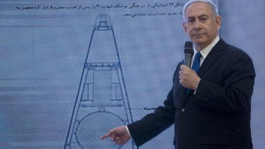 Israeli Prime Minister Benjamin Netanyahu presents material on Iranian nuclear weapons development during a press conference in Tel Aviv last week.