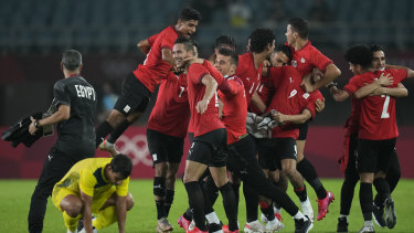 Egyptâs players celebrate their 2-0 victory over Australia.