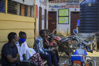 Patients wait to be treated at the Butsili health centre in Beni: the Democratic Republic of Congo is battling both COVID and Ebola this year. 