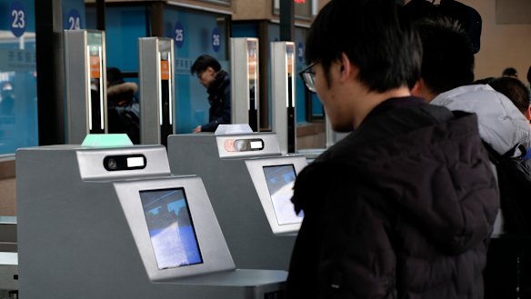 Passengers are warned over the railway station's PA system to behave or their behaviour will be recorded on their social credit file.
