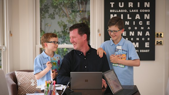 Officeworks general manager finance Justin McKernan (with sons Hamish, left, and William), has enjoyed the extra time with family while working from home.